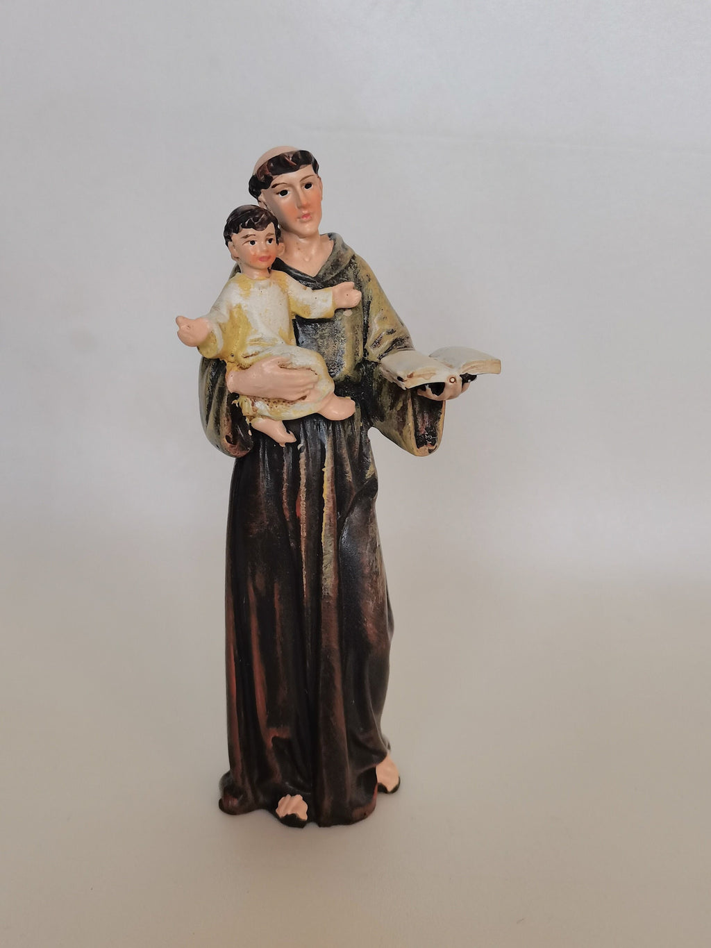 Statue des heiligen Antonius von Padua mit dem Jesuskind und Evangelium aus bemaltem Kunstharz