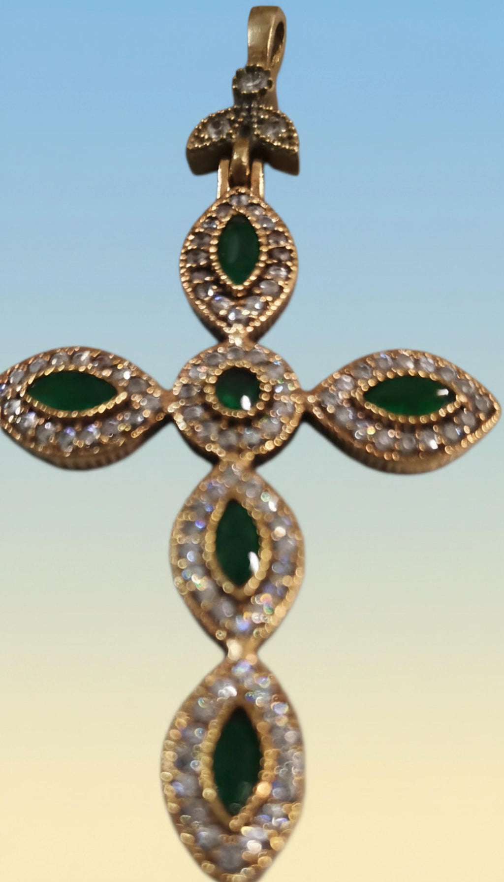 925 gold-plated silver cross with cubic zirconia and a teardrop-shaped light blue stone